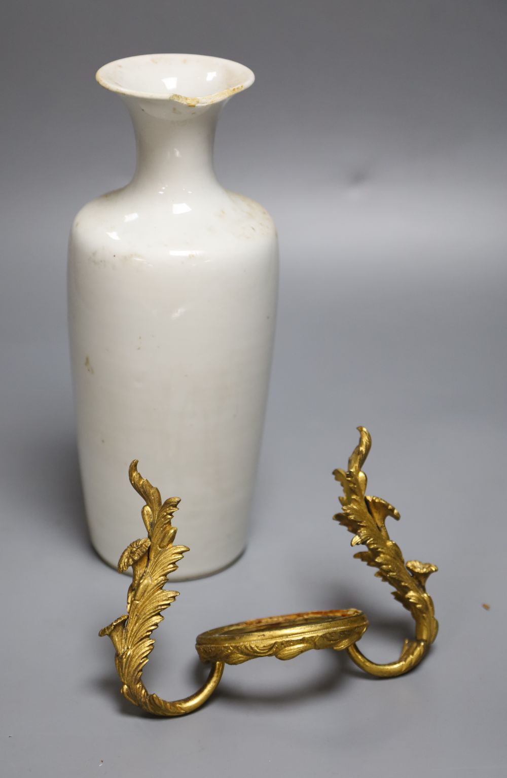 A 19th century Chinese blanc de chine mounted vase, height 24cm (a.f.), on ormolu rococo mount